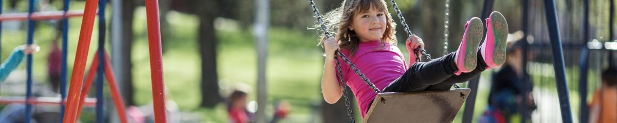 Girl on park swing.